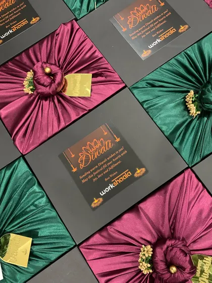 For Workshaala's Diwali gifting, I designed these elegant black boxes with a custom card and beautiful satin fabric wrapping. This shows how corporate branding can be seamlessly integrated with festive aesthetics.
