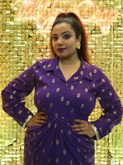 A powerful pose in a vibrant purple dress, ready to take the stage for a Sangeet. My outfits are an extension of the event's energy, and this one was all about royal fun.