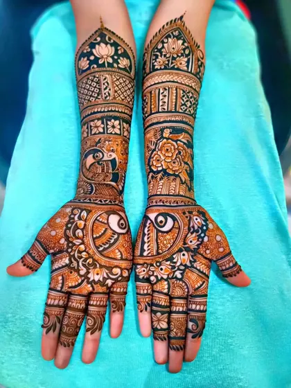 A lovely design with peacocks, lotuses, and roses, perfect for a bride who loves floral and bird motifs.