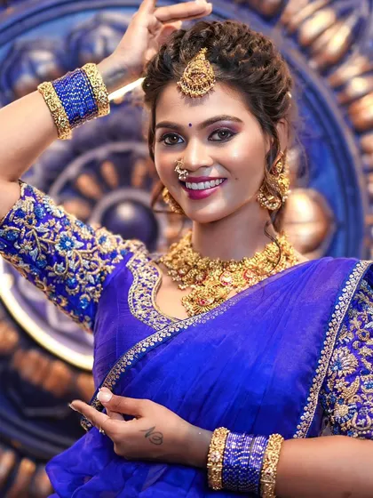 A full view of the embroidered blouse paired with a brocade half saree, showcasing a complete and regal ethnic ensemble.
