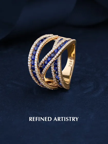 Crafted with passion and defined by artistry. This unique ring features interwoven bands of blue sapphires and white diamonds, creating a dynamic and luxurious design. The Zohra mark is proudly stamped inside the band.