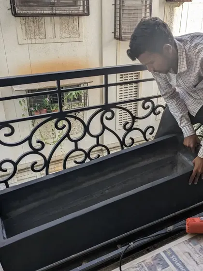 Here I am installing a custom-sized rectangular FRP planter on a client's balcony. These planters are perfect for creating privacy screens or for gardening in narrow spaces.