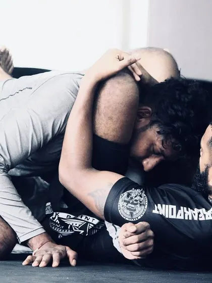 A great shot from a BJJ rolling session. This shows the intensity and focus required in grappling. We constantly work on winning these small moments, improving our position, and looking for the submission.