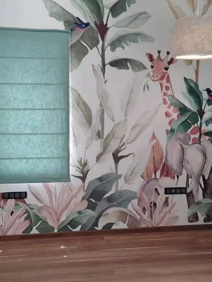 A jungle-themed mural for a kid's room, featuring a giraffe and an elephant.
