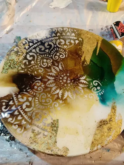 Another beautiful piece from my alcohol ink resin art workshop. Learn to blend inks and use stencils to create mesmerizing mandala designs.