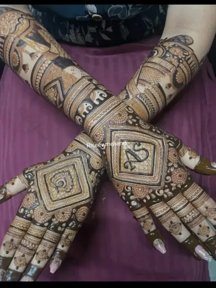 This intricate bridal design features the couple's initials 'AS' and a peacock motif, blending personal touches with timeless traditional art.