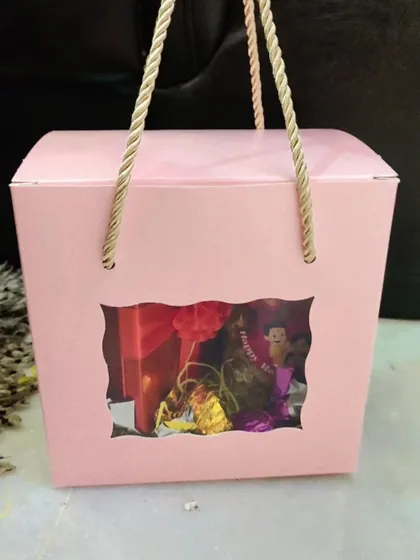 A still image of the pink two-jar window box, a simple and sweet Rakhi gift.