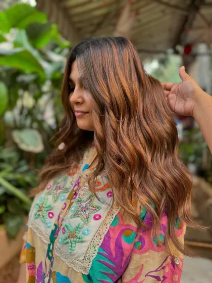 A side view of this beautiful bridal hair. The soft waves and warm brown color are a perfect match. (No filter)