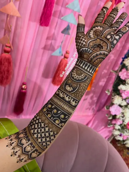 A single arm bridal design, showcasing a mix of lotus motifs, jaal patterns, and traditional bands.