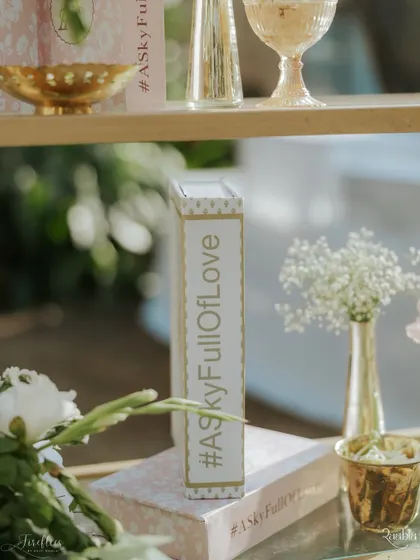 A decorative book prop featuring the couple's wedding hashtag, a simple yet effective way to personalize the space.