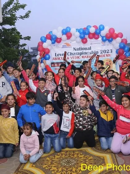 Students celebrating their participation in the championship. We believe that participation itself is a victory, building confidence and a love for learning.