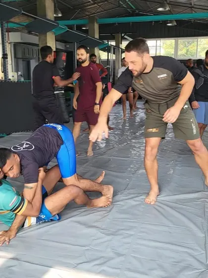 Dustin Stoltzfus providing detailed corrections on ground control positioning during a drill. This level of focused attention is what makes our guest seminars so valuable for skill development.