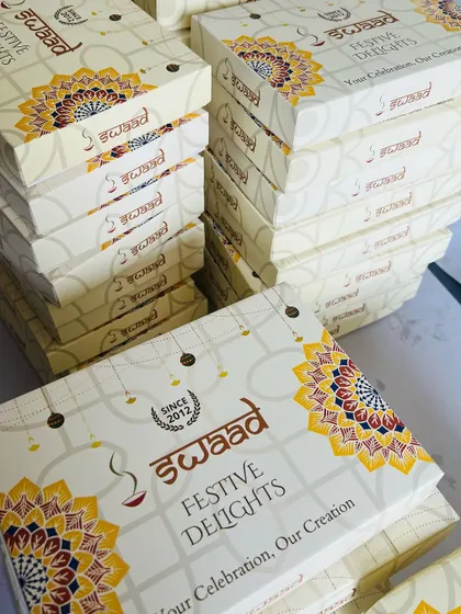 Managing bulk orders is our specialty. Here are our branded 'Festive Delights' boxes stacked and ready for a large corporate client in Bengaluru, ensuring timely and professional delivery for your events.