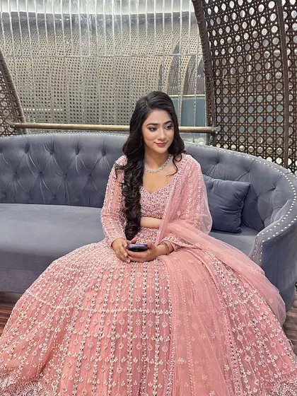 This client chose a gorgeous pink lehenga for her engagement. I designed a soft glam look with a focus on glowing skin and pink tones to match her outfit perfectly.