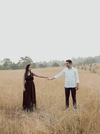 A minimalist composition of the couple in a field, symbolizing them starting their path together.