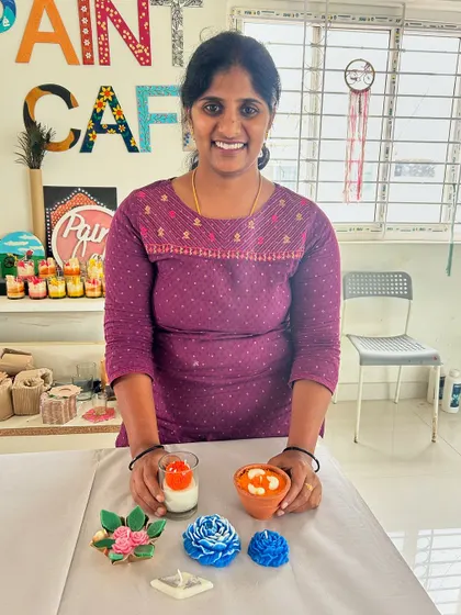A participant with her beautiful set of handmade candles, including floral, dessert, and traditional diya styles.