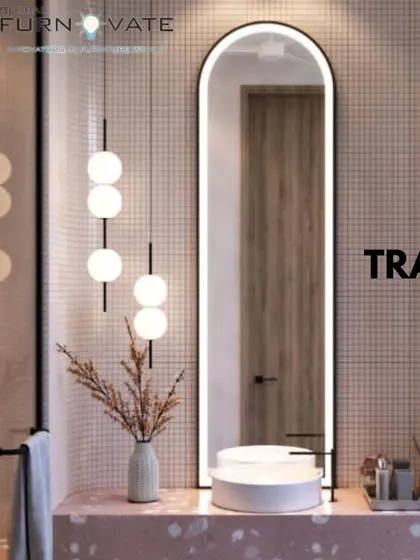 A chic bathroom with pink terrazzo countertops and small square wall tiles. The backlit arched mirror and modern pendant lights add a touch of elegance and provide excellent lighting.