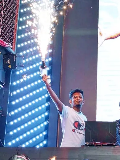 Celebrating a high point in the set with a bottle sparkler. I use these special effects to mark big moments and add excitement to the night.