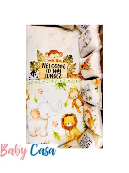 "Welcome to my Jungle." This fun and vibrant bedding set is perfect for a little explorer, featuring a quilt and pillows with adorable printed safari animals like elephants, lions, and monkeys.