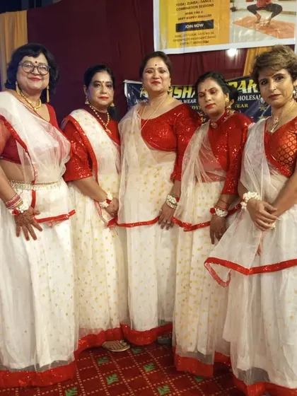 A closer look at our performers' coordinated outfits for a festival stage show. The red and white theme creates a powerful and unified look on stage.