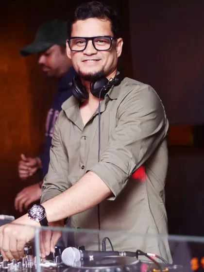 A smile from behind the decks. I genuinely love what I do, and I think it shows in my performance.