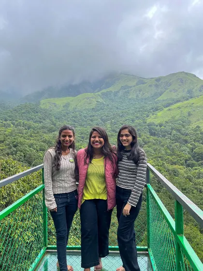 A group of friends at a viewpoint in Wayanad.