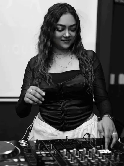 A simple, elegant black and white photo of me at the console, focused on my craft.