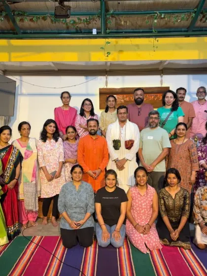 A group photo with participants and speakers after the Yoga Vichara talk by Dr. Vishwanath M V.