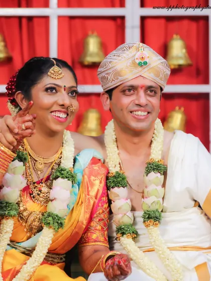 A joyful candid moment from a wedding ceremony. The bride's bright smile and the happy atmosphere make this a wonderful memory to look back on.