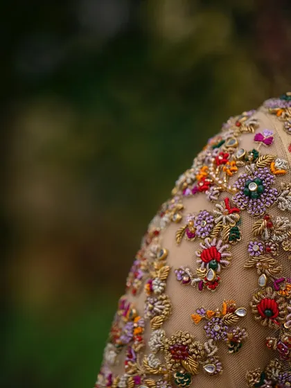 A collection of detailed shots focusing on the diverse and intricate embroidery of my custom blouses. These images highlight the fine craftsmanship, luxurious materials, and unique designs that define my work.
