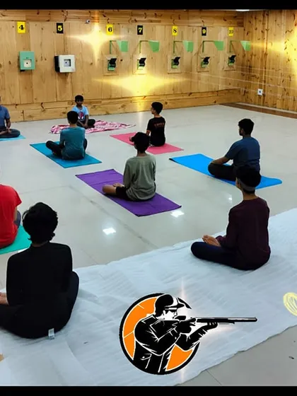 My training philosophy is holistic. Here, young shooters participate in a yoga and recovery session, which helps improve focus, calm, and physical stability essential for high performance in shooting sports.
