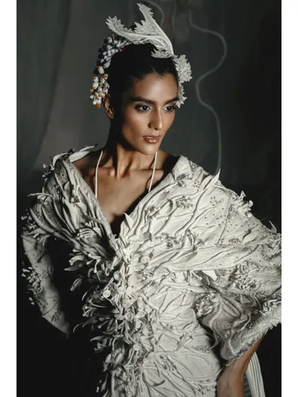A detailed close-up of a textured white garment from the Vaishali S campaign. This type of shot is crucial for showcasing the intricate handiwork that defines couture fashion.