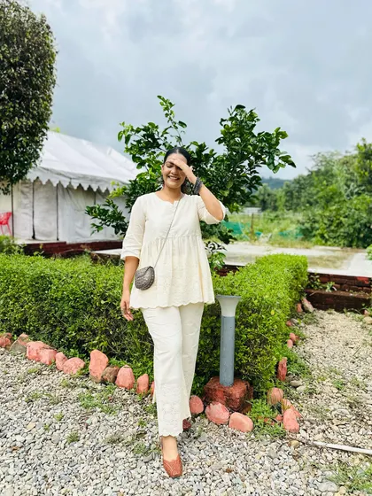 A happy, candid shot in this comfortable and elegant white suit.