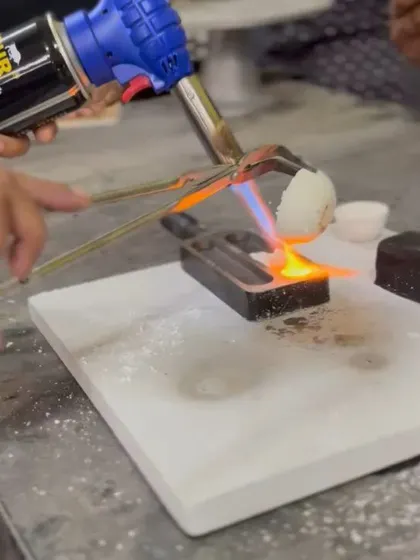 A close-up shot of the initial silver melting process, a key step in our hands-on silversmithing workshop.