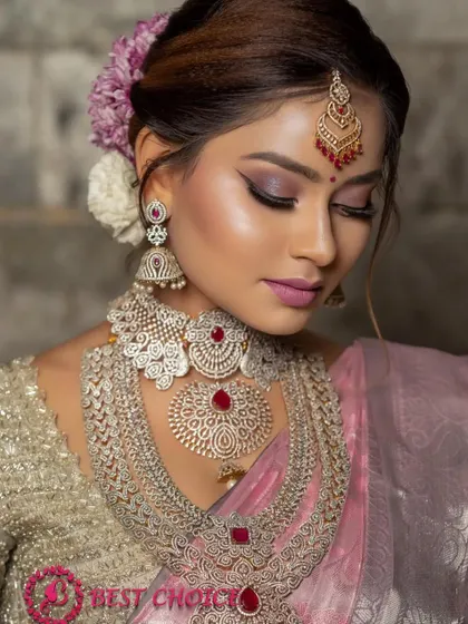 A detailed shot of our layered reception necklace. The design features multiple layers of sparkling stones, creating a look of pure opulence.