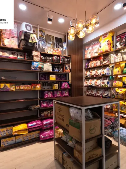 Effective merchandising requires thoughtful store layout design. Here, the custom shelving provides ample space for a wide variety of pet products, ensuring everything is organized, accessible, and easy for customers to browse.
