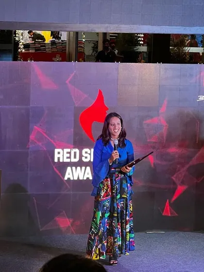 Speaking to the audience after receiving my award. I shared my story to hopefully inspire other young girls to pursue their dreams in sports and business.
