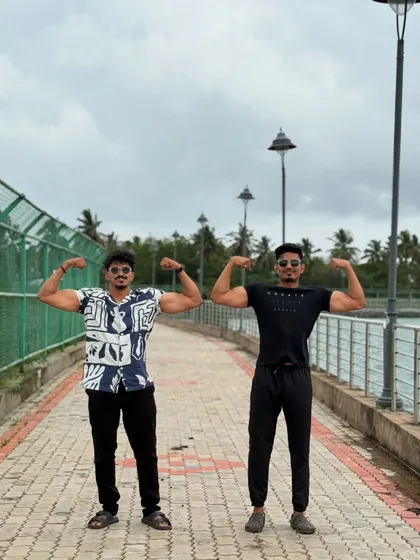 Another shot with my gym buddy, showing our physiques.