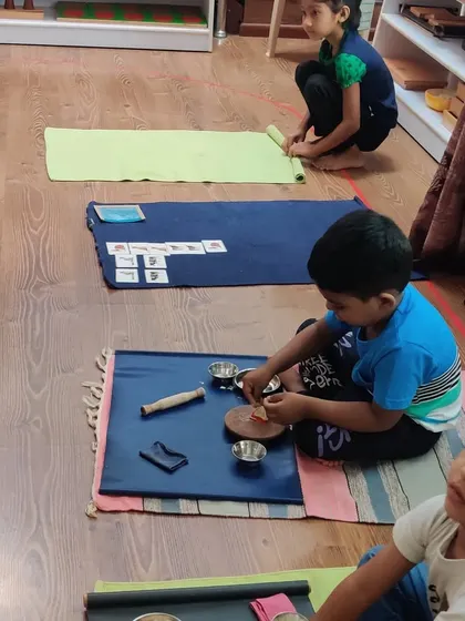 Children are busy and focused on the first day of school. The calm and orderly environment allows them to choose their work and concentrate deeply from the moment they arrive.