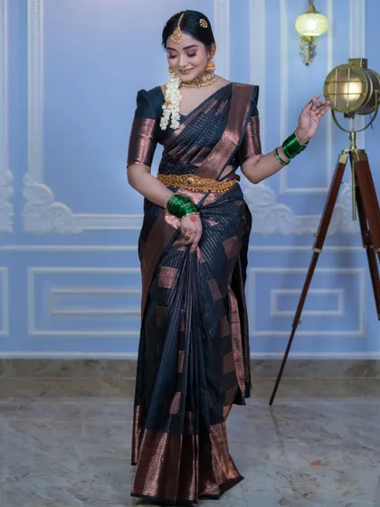 This full-length view shows how our rental temple jewellery, including the vaddanam (hip belt), completes the traditional silk saree look.