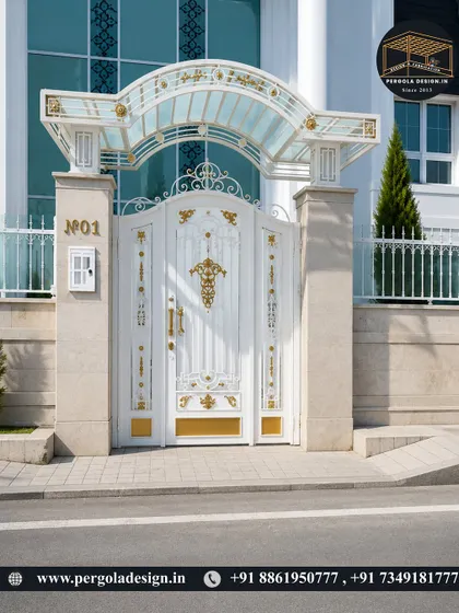 A truly grand entrance featuring an ornate white and gold gate topped with a custom glass canopy. This is a prime example of our luxury fabrication capabilities, creating a regal first impression.