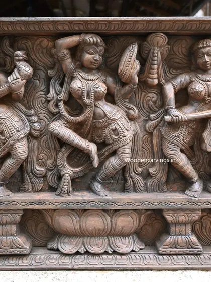 This view of the Apsara panel highlights a trio of celestial performers. The composition balances musical and dance elements, creating a rhythmic flow across the entire 73-inch length of the carving.