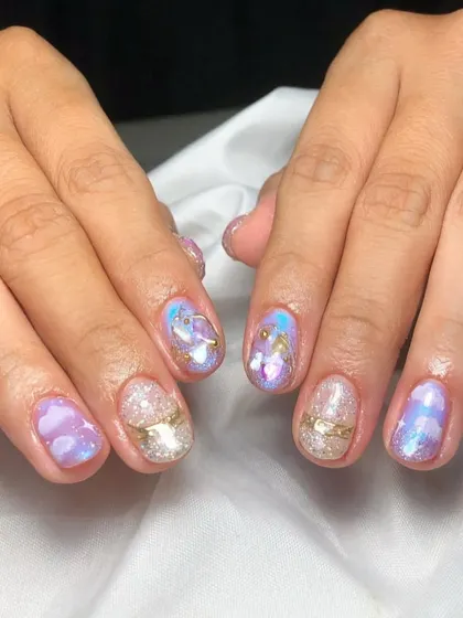 This abstract set has a celestial, galaxy-like feel, with a mix of purple and blue watercolor effects, gold accents, and a "sugar" glitter nail.