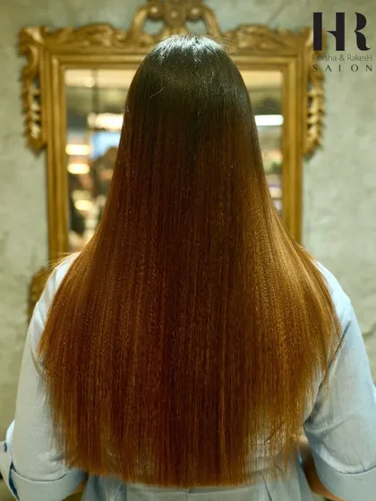 A unique take on styling after a smoothing treatment, with crimped ends adding texture to the otherwise sleek hair.
