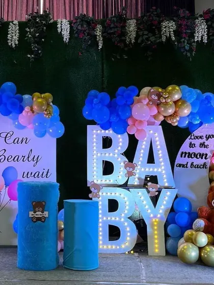 This gender reveal setup uses the teddy bear theme with a fun twist. We combined blue and pink balloons with large, light-up "BABY" letters and multiple teddy bear details to build excitement for the big announcement.