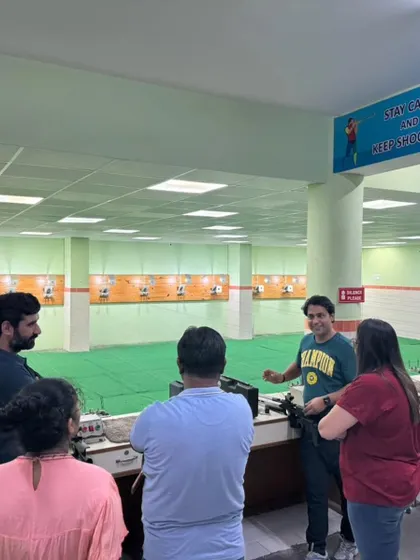 A group of friends enjoying a different kind of weekend activity. I am explaining the basics of air rifle handling before they start their practice.
