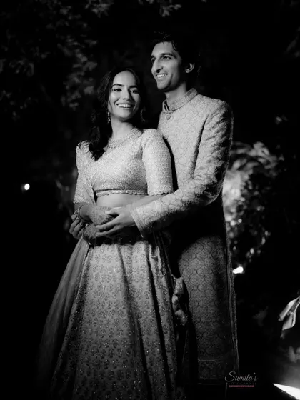 A happy, relaxed couple portrait in black and white. Their genuine smiles and comfortable embrace make this a beautiful, timeless memory from their event.