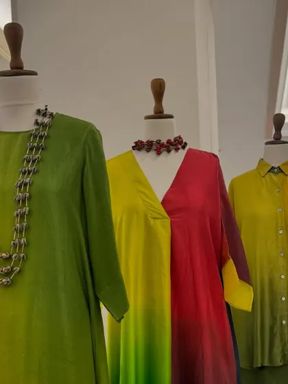 A stunning display of ombre tunics by Meghna Panchmatia. The gradual shift in colors from green to yellow to red creates a beautiful, artistic effect.