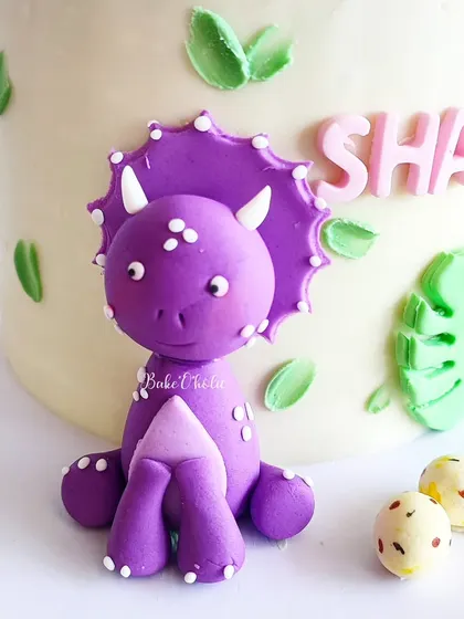 A detailed look at the purple triceratops topper. I love sculpting these little characters to bring a theme to life.