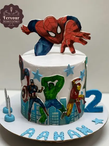 An action-packed Marvel Avengers theme cake for a 2nd birthday. It features popular heroes like Spider-Man, Hulk, and Captain America, ready to save the day on a delicious chocolate mousse cake.